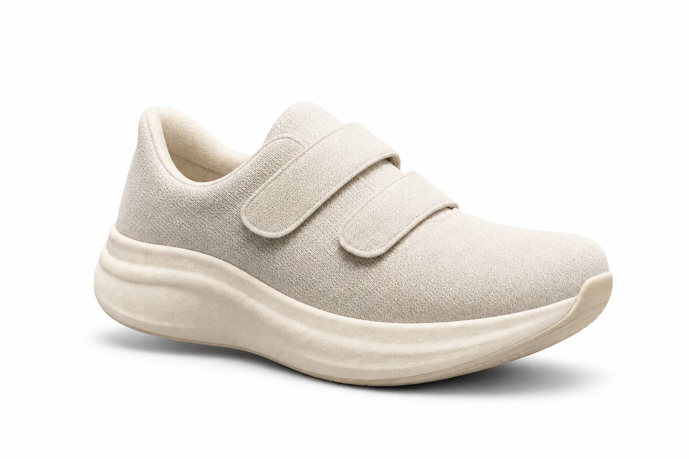 The Everyday — Wide Fit Trainer in Chalk White, three-quarter view showing the two adjustable straps and rocker midsole
